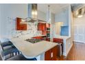 Modern kitchen featuring a large island, cherry cabinets, and stainless steel appliances at 3820 Roswell Ne Rd # 902, Atlanta, GA 30342