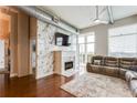 Beautiful living room with a marble fireplace, hardwood floors, and natural light at 3820 Roswell Ne Rd # 902, Atlanta, GA 30342