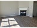 The living room features light gray walls, hardwood floors, and a modern fireplace at 295 Laurelton Cir, Lawrenceville, GA 30044