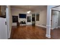 Spacious living room with hardwood floors and a fireplace at 460 Greystone Ln, Douglasville, GA 30134