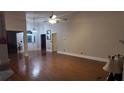 Spacious living room featuring hardwood floors, neutral walls, and generous natural light at 460 Greystone Ln, Douglasville, GA 30134