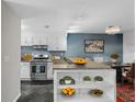 Kitchen and dining area with sleek stainless steel appliances and modern cabinetry at 401 Woodcliff Dr, Atlanta, GA 30350
