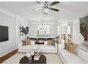 Bright open-concept living room and dining area with modern decor, hardwood floors, and lots of light at 4718 Wehunt Se Trl # 20, Smyrna, GA 30082