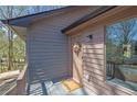 Charming front porch with a welcoming door and colorful wreath on display at 4843 Caboose Nw Ln, Acworth, GA 30102