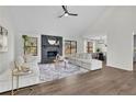 Beautiful living room with a fireplace and seamless flow to dining area at 4843 Caboose Nw Ln, Acworth, GA 30102