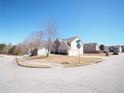 Exterior view of a charming two-story home on a corner lot in a quiet neighborhood at 7267 Appaloosa Cv, Fairburn, GA 30213