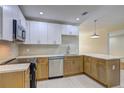 Well-lit kitchen featuring modern stainless appliances, bright countertops, and ample cabinet space at 810 Commodore Nw Dr, Atlanta, GA 30318