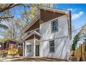 Beautiful two-story home exterior with modern architectural details, including brown accents, and a covered front porch at 1350 Elizabeth Sw Ave, Atlanta, GA 30310