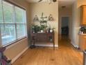 Cozy dining area featuring hardwood floors and ample natural light from the large window at 179 Bradshaw Park Dr, Woodstock, GA 30188
