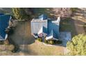 Aerial view of a brick home with a large yard and mature trees at 3152 Parks Run, Loganville, GA 30052