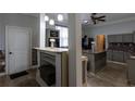 Modern kitchen with custom cabinets, granite countertops, and stainless steel appliances at 4985 Union St, Union City, GA 30291