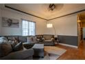 Spacious living room with stylish furniture, a plush area rug, and hardwood flooring at 4985 Union St, Union City, GA 30291