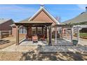 Backyard patio with a pergola offering an outdoor dining and relaxing space at 1993 Shenley Park Ln, Duluth, GA 30097