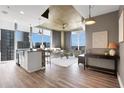 Open concept living space with modern kitchen island and cityscape views at 855 Peachtree Ne St # 1703, Atlanta, GA 30308