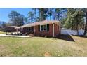Beautifully landscaped lawn with a classic brick home at 4715 Greensprings Rd, College Park, GA 30337