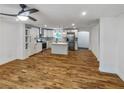 Spacious kitchen featuring hardwood floors, white cabinets, and stainless steel appliances at 1330 Lanvale Sw Dr, Atlanta, GA 30310