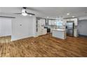 Spacious kitchen featuring hardwood floors, white cabinets, and stainless steel appliances at 1330 Lanvale Sw Dr, Atlanta, GA 30310