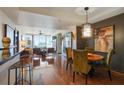 Chic dining area featuring wood floors, stylish lighting, and city views at 3338 Peachtree Ne Rd # 2405, Atlanta, GA 30326