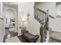 Elegant foyer features hardwood floors, staircase, stylish decor, and seamless transition to the living area at 2449 Suwanee Pointe Dr, Lawrenceville, GA 30043