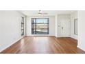 Sun-drenched living room boasts hardwood floors and expansive windows, a welcoming entryway at 472 Martin Se St # 1, Atlanta, GA 30312