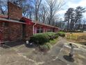 Exterior view with mature green shrubbery and a decorative birdbath at 1404 Aniwaka Sw Ave, Atlanta, GA 30311