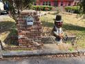 Unique brick mailbox post accompanied by a vintage garden statue feature at 1404 Aniwaka Sw Ave, Atlanta, GA 30311