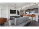 Open-concept living area with stylish furnishings, a modern kitchen, and plenty of natural light at 1080 Peachtree Ne St # 1610, Atlanta, GA 30309