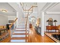 Elegant foyer with hardwood floors and staircase, showcasing a bright and welcoming entryway at 1775 Unity Loop, Cumming, GA 30040