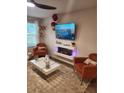 Cozy living room featuring modern fireplace, plush seating, and a bright window at 4860 Station Lane -Lot 23, Union City, GA 30349