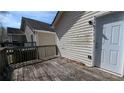 Rustic wooden deck with siding and back door at 7128 Crystal Creek Pl, Douglasville, GA 30134