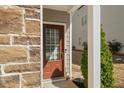 Stylish front door featuring a glass window pane and adjacent landscaping at 372 Mulberry Se Row, Atlanta, GA 30354