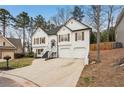 Lovely two-story house with brick exterior, two-car garage and a well-maintained lawn at 4554 Alaspair Ln, Acworth, GA 30101