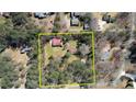 Aerial view of large property with a house and barn surrounded by a wooded area at 5190 Paul Sw Cir, Conyers, GA 30094