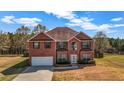 Charming two-story brick home featuring a well-manicured lawn and inviting curb appeal at 4970 Wewatta Sw St, Atlanta, GA 30331