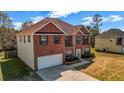 An exterior view of a brick home featuring an attached garage and side-yard access at 4970 Wewatta Sw St, Atlanta, GA 30331