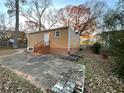 Back of house featuring concrete patio, back door, and partially fenced in yard at 488 Mcwilliams Se Ave, Atlanta, GA 30316