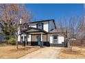 Beautiful two-story home featuring black trim, white siding, and a bright blue front door at 131 Scruggs Ne Ct, Atlanta, GA 30307