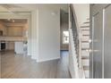 Inviting entryway features hardwood floors, staircase, and an open view of the kitchen at 212 Eleanora Way, Loganville, GA 30052