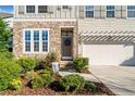 Close up shot of a well landscaped front yard with stone accents on a two-story home at 273 Amylou Cir, Woodstock, GA 30188