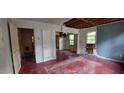 View of a distressed living room with peeling paint and damaged walls at 1182 Bronx Nw St, Atlanta, GA 30314