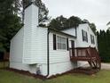 Charming split-level home with a wood deck, chimney, and well-maintained landscaping with fresh mulch at 1848 San Gabriel Ave, Decatur, GA 30032