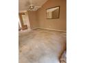Large living room with ceiling fan, lots of light, and neutral colored walls at 210 Vintage Dr, Covington, GA 30014