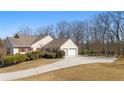 Spacious two-car garage and well-manicured lawn complement this home's exterior at 4740 Union Hill Rd, Canton, GA 30115