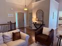 Inviting foyer with hardwood floors, console table, and an arched decorative mirror at 410 Spring Lake Hls, Canton, GA 30114