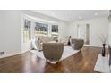 Bright and inviting living room with hardwood floors, a bay window, and modern furnishings at 335 Amberidge Trl, Sandy Springs, GA 30328