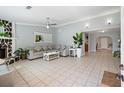 Spacious living room featuring tiled flooring, a stone fireplace, and neutral gray walls for a modern aesthetic at 3776 Bromolow Trl, Lawrenceville, GA 30044