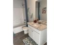 Clean bathroom with granite countertops, a single sink vanity, and shower and tub combo at 740 Great Oak Pl, Villa Rica, GA 30180
