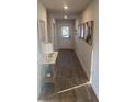Bright hallway with wood-look flooring, stylish decor, and recessed lighting creates a welcoming entrance at 740 Great Oak Pl, Villa Rica, GA 30180