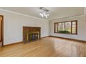 Spacious living room with hardwood floors, fireplace, and modern lighting at 1312 Milstead Ave, Conyers, GA 30012