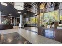 View of the building lobby featuring sleek flooring, a display case, and a view of the exterior at 215 Piedmont Ne Ave # 2205, Atlanta, GA 30308